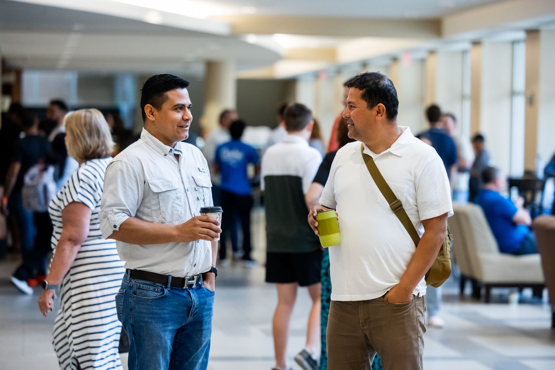 A solicitor talking with local business contacts at a networking event