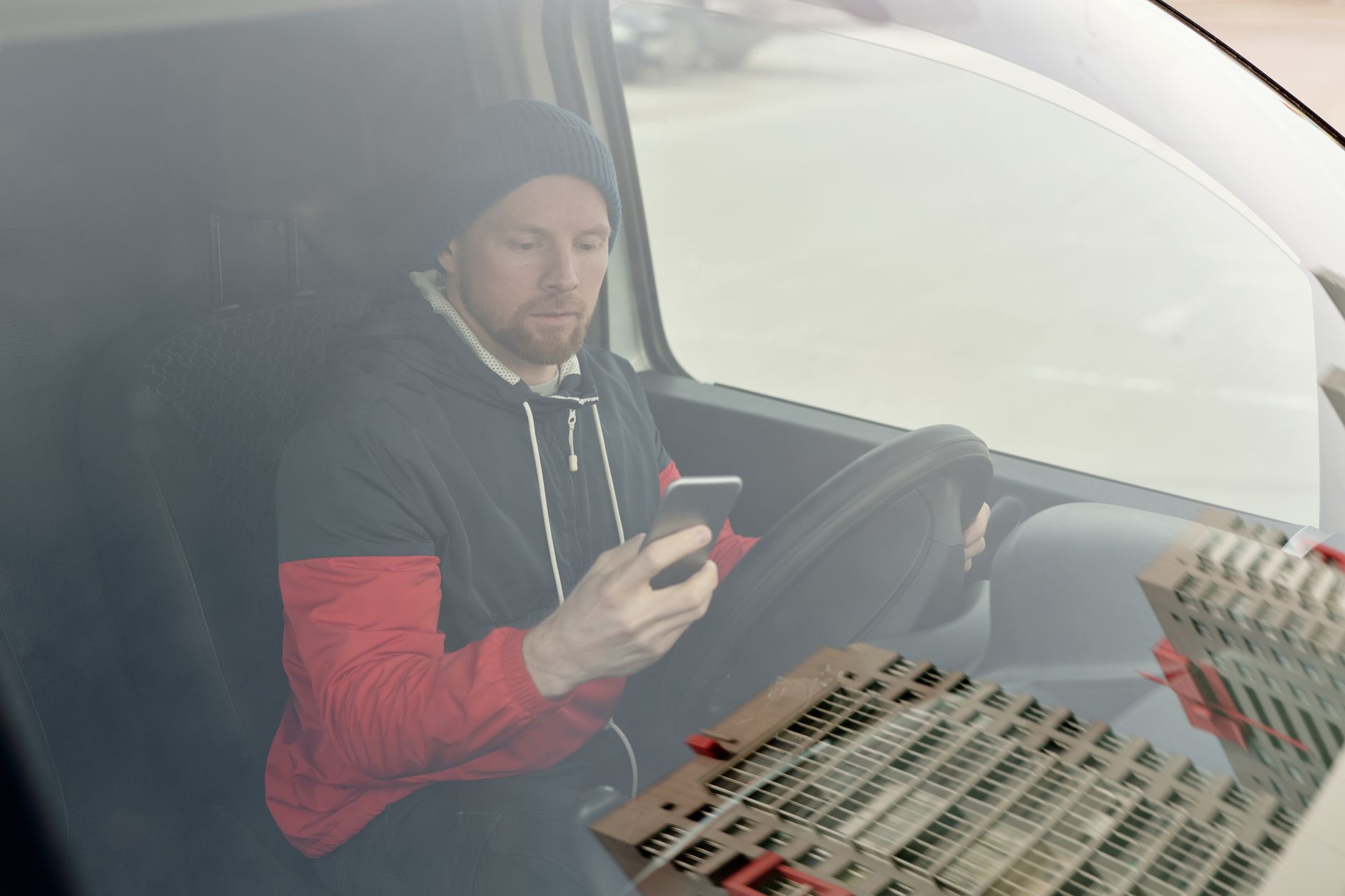 A tradesman updating his business listing from his van