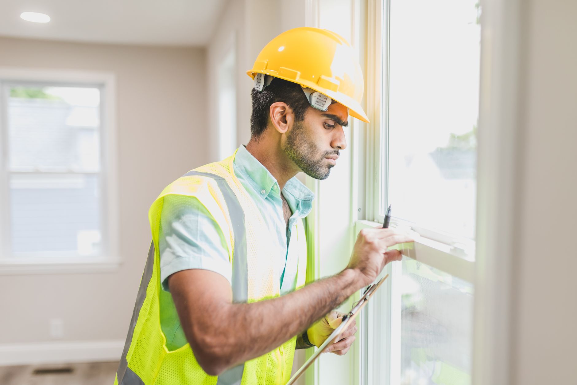 A roofer reviewing a job that came in slower than expected