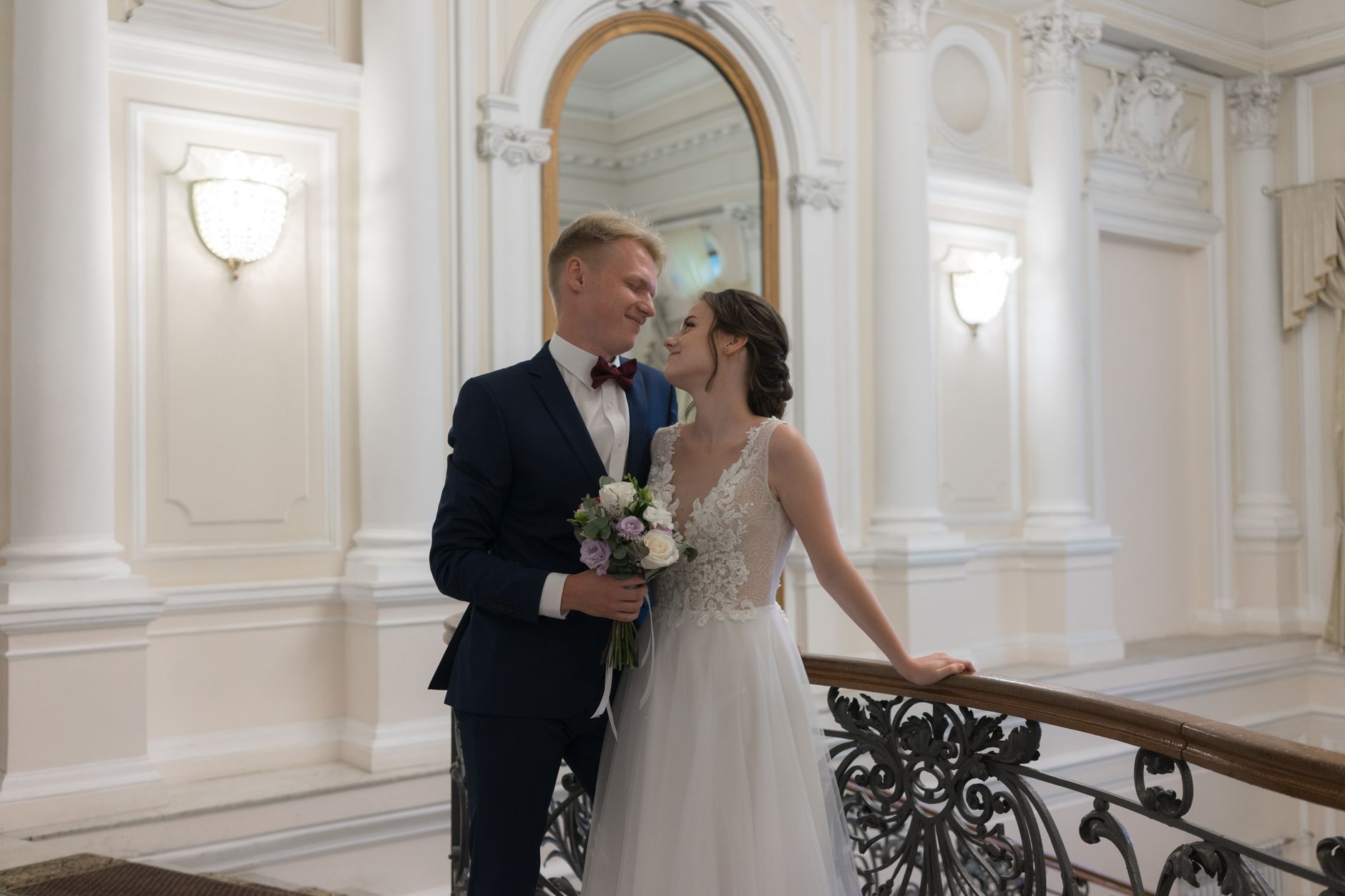 A couple touring a wedding venue with the owner months before their date