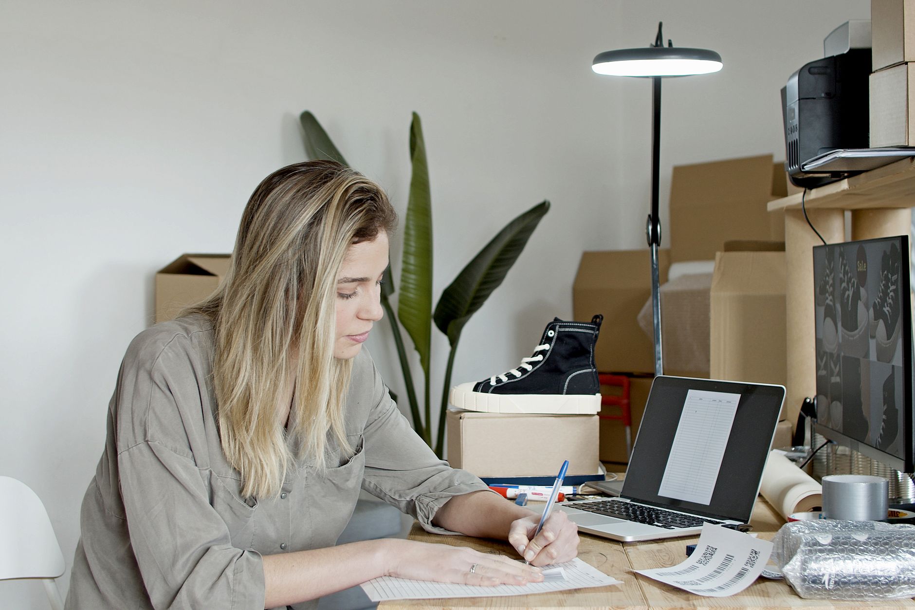 An owner working step by step through setting a marketing goal