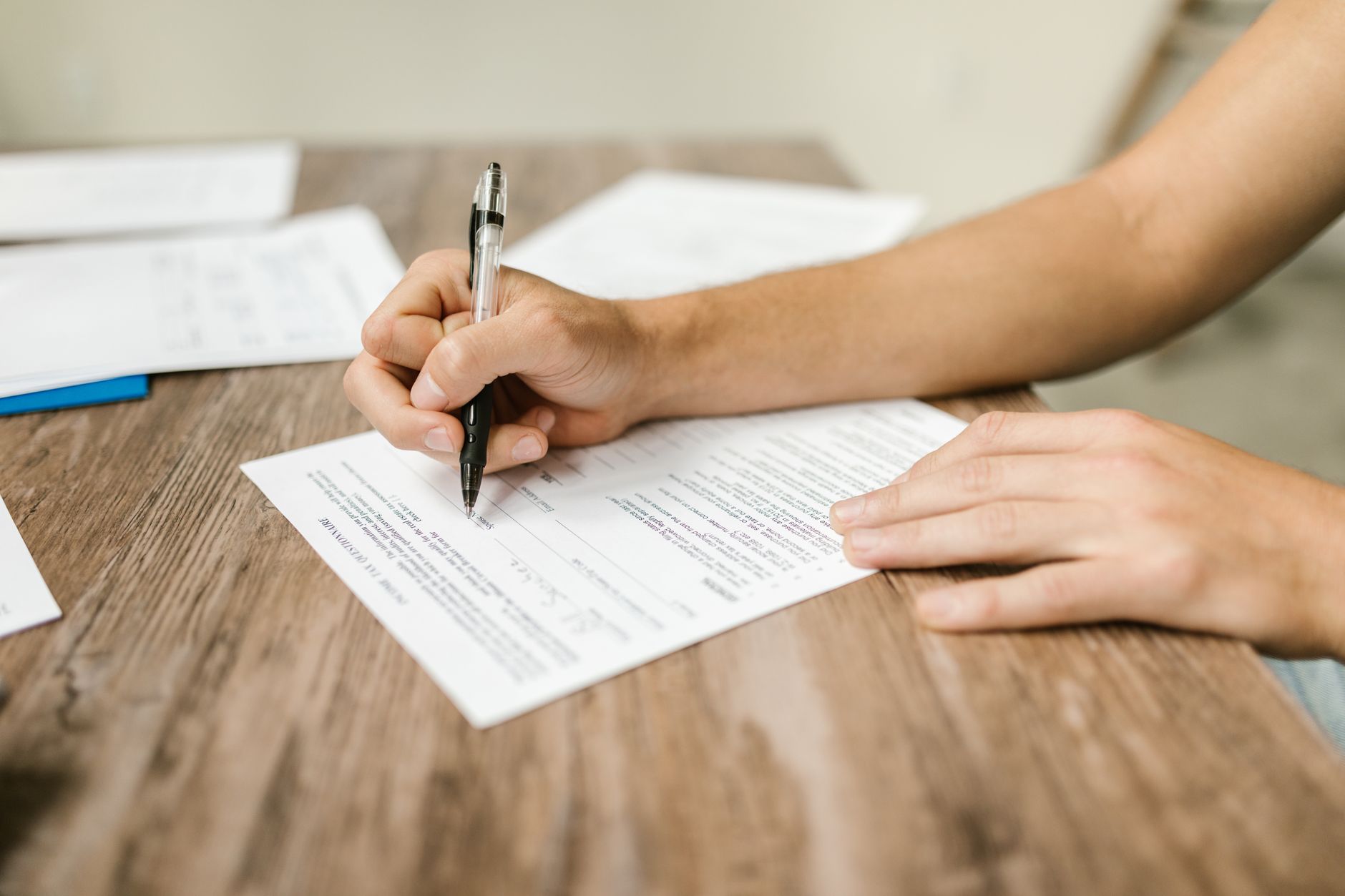 A small business owner filling in a marketing plan template at their desk