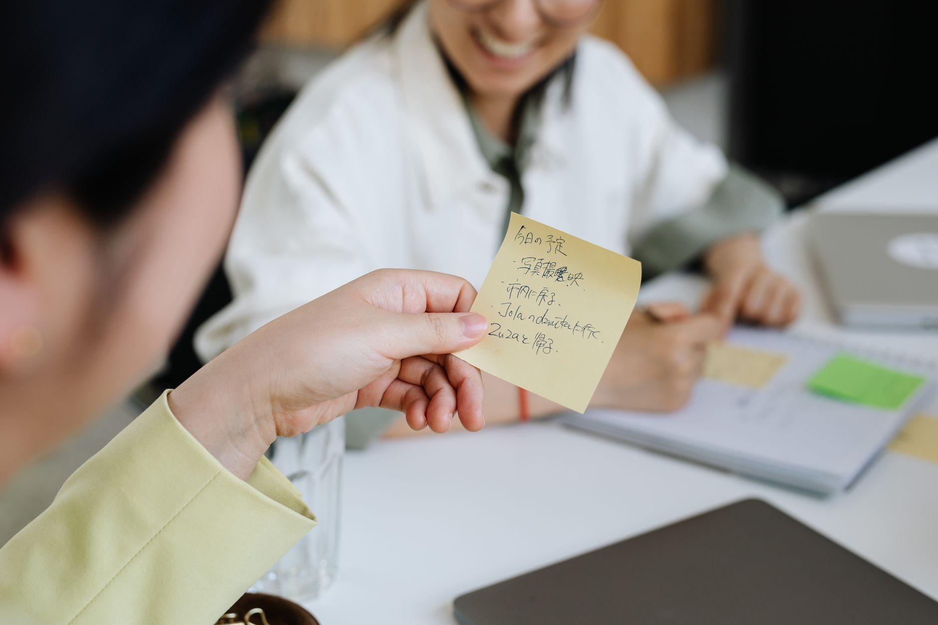Two colleagues mapping out their marketing with sticky notes on a table
