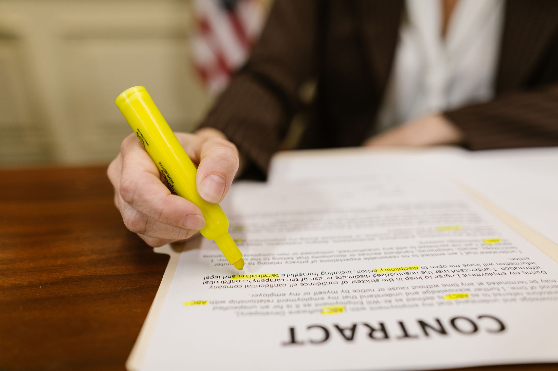 A course creator reviewing their website copy with a highlighter