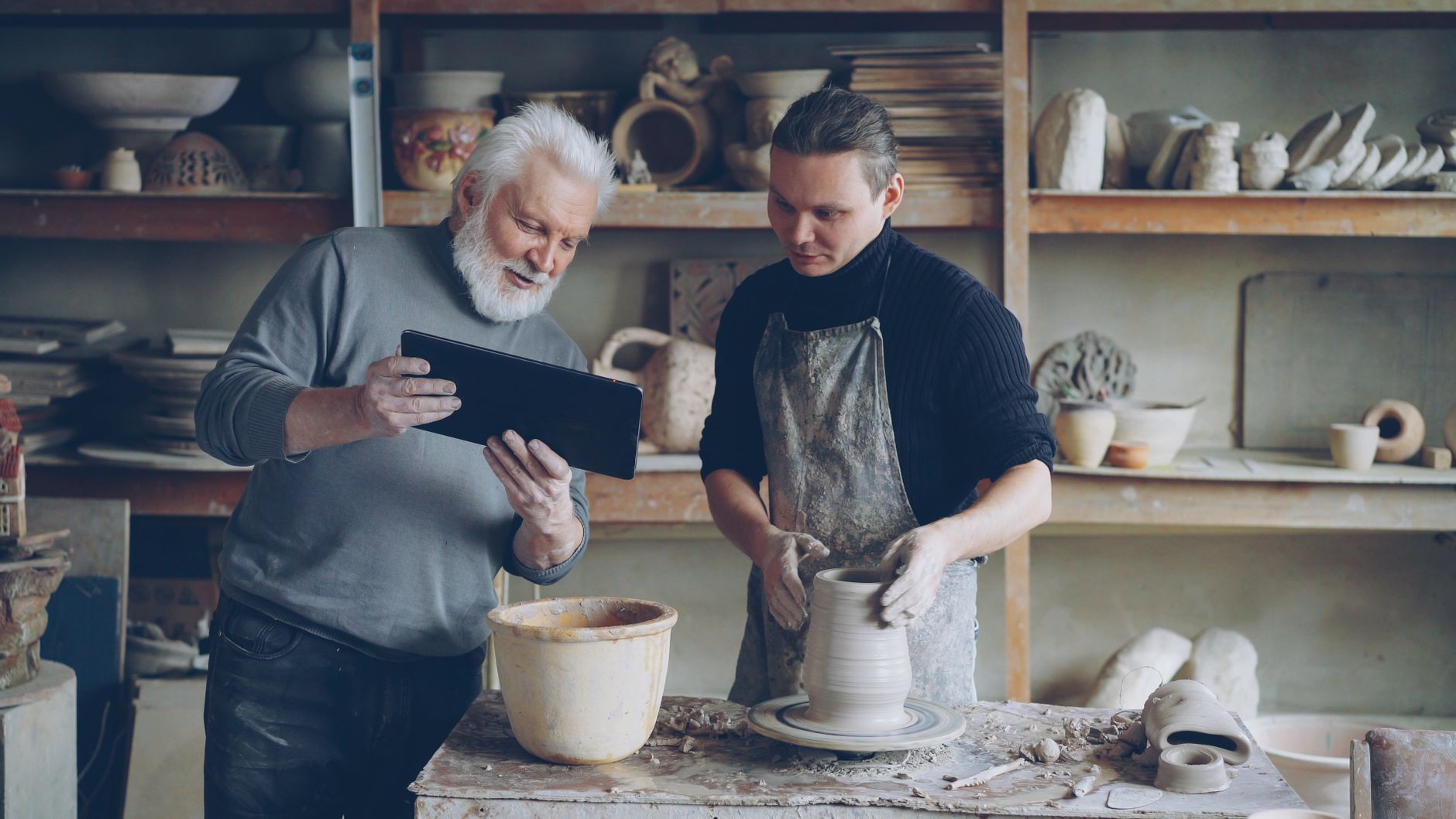 A pottery teacher preparing photos and headings for their course page