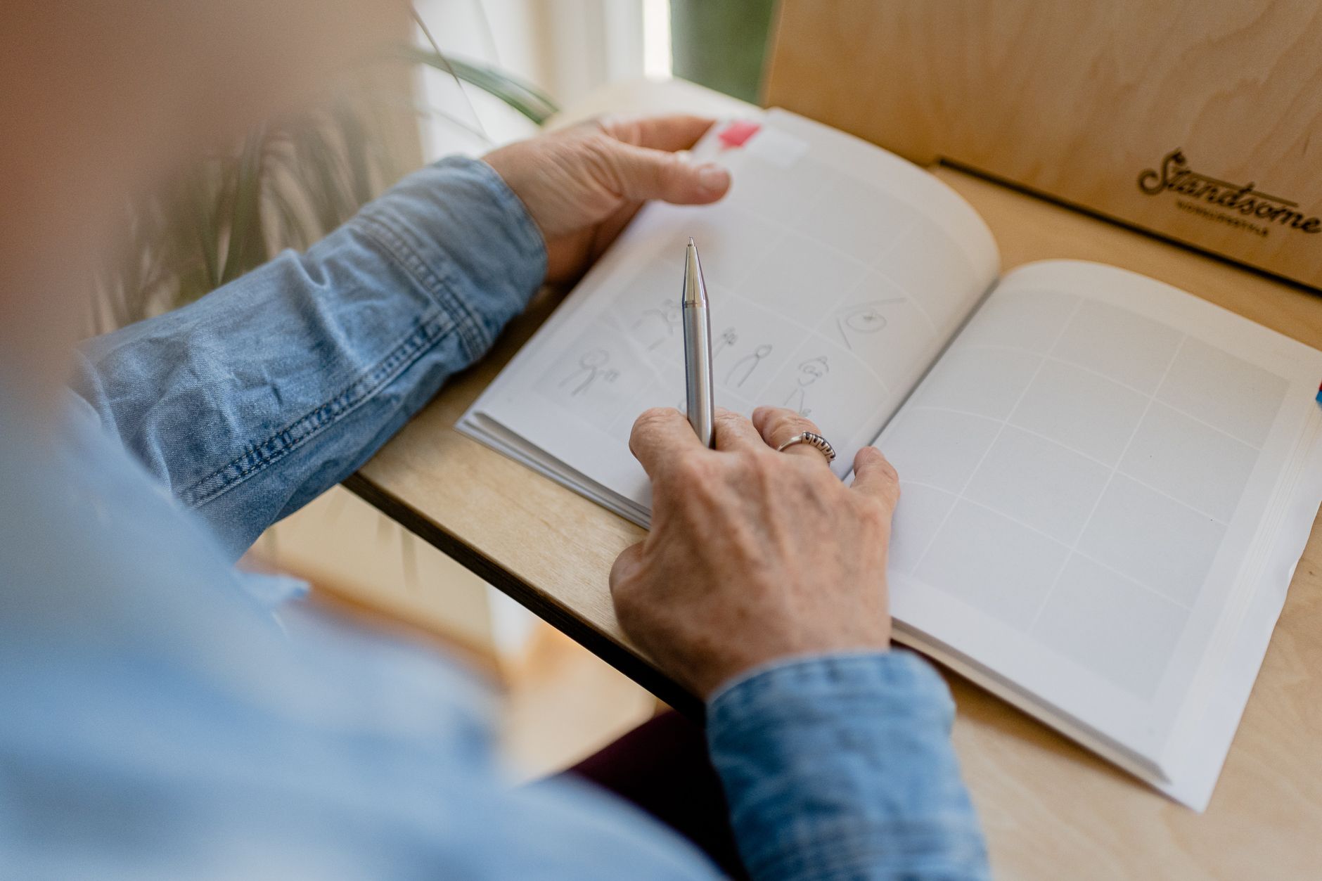 A business owner sketching out the sections of their plan