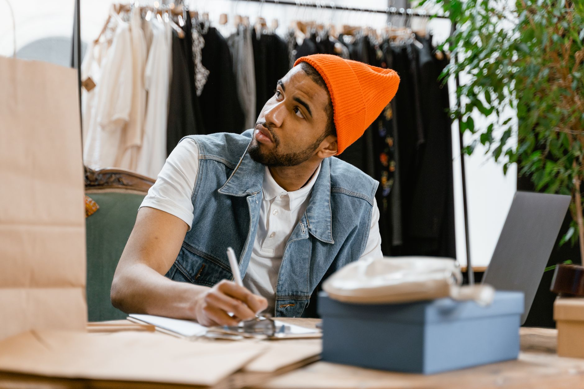 A small business owner writing their own marketing at their desk