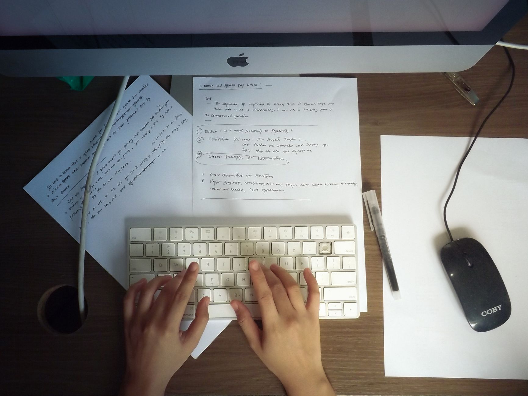 A founder checking a printed draft against their notes