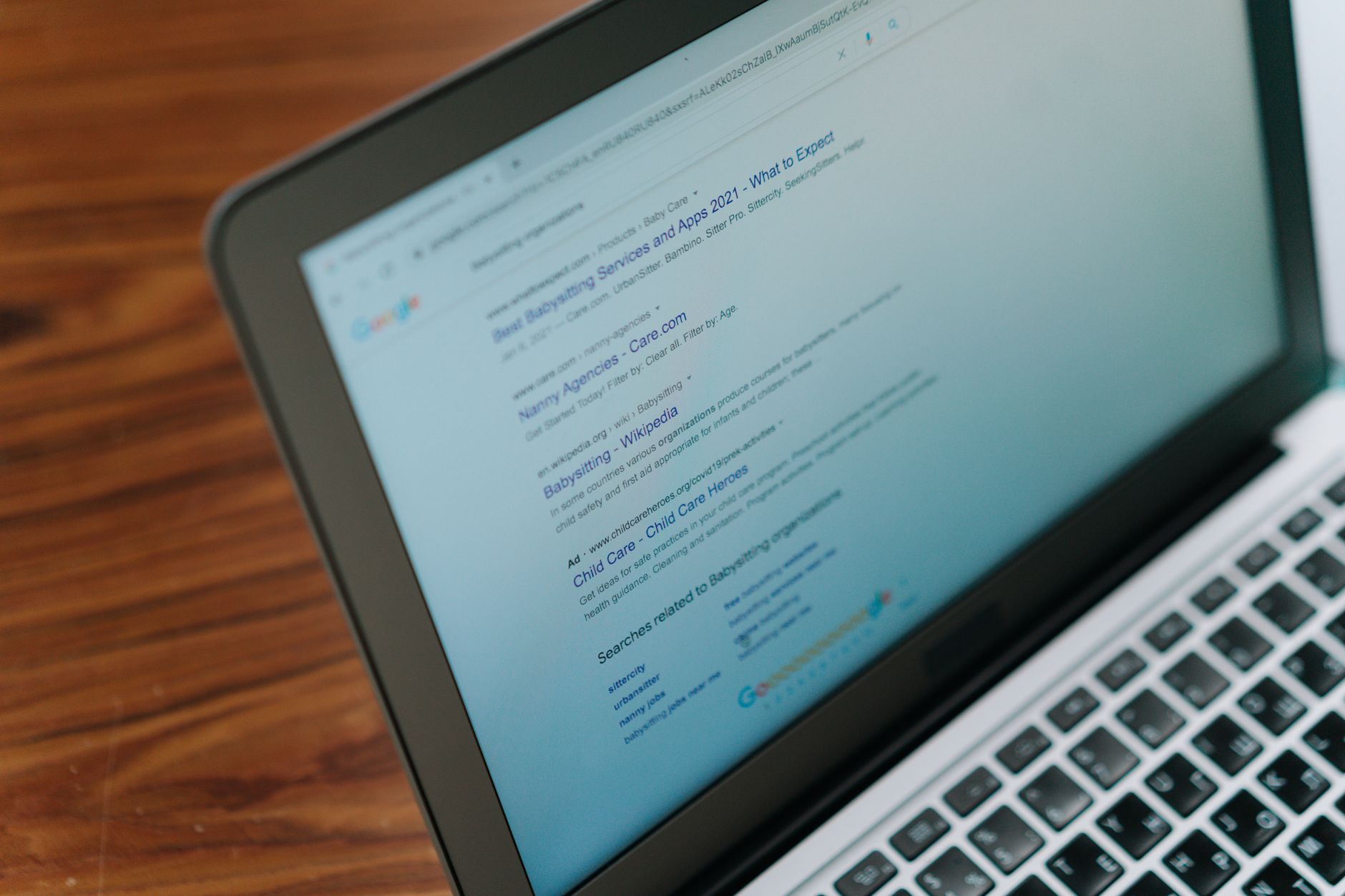 A founder reviews a clean product landing page on a laptop, refining the words and proof points that do the selling.