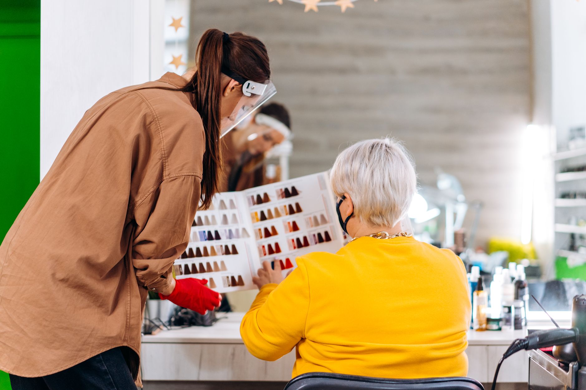 A hairdresser looking at a quiet appointment book in January