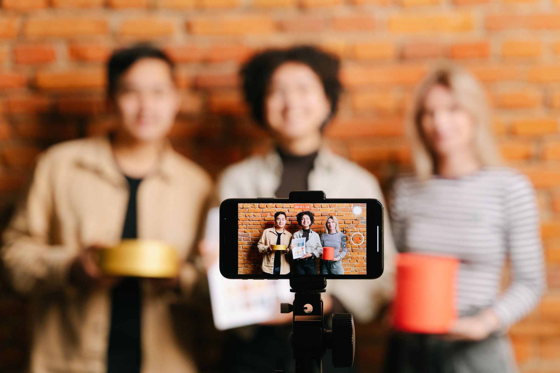 A business owner filming a short video of their work for social media