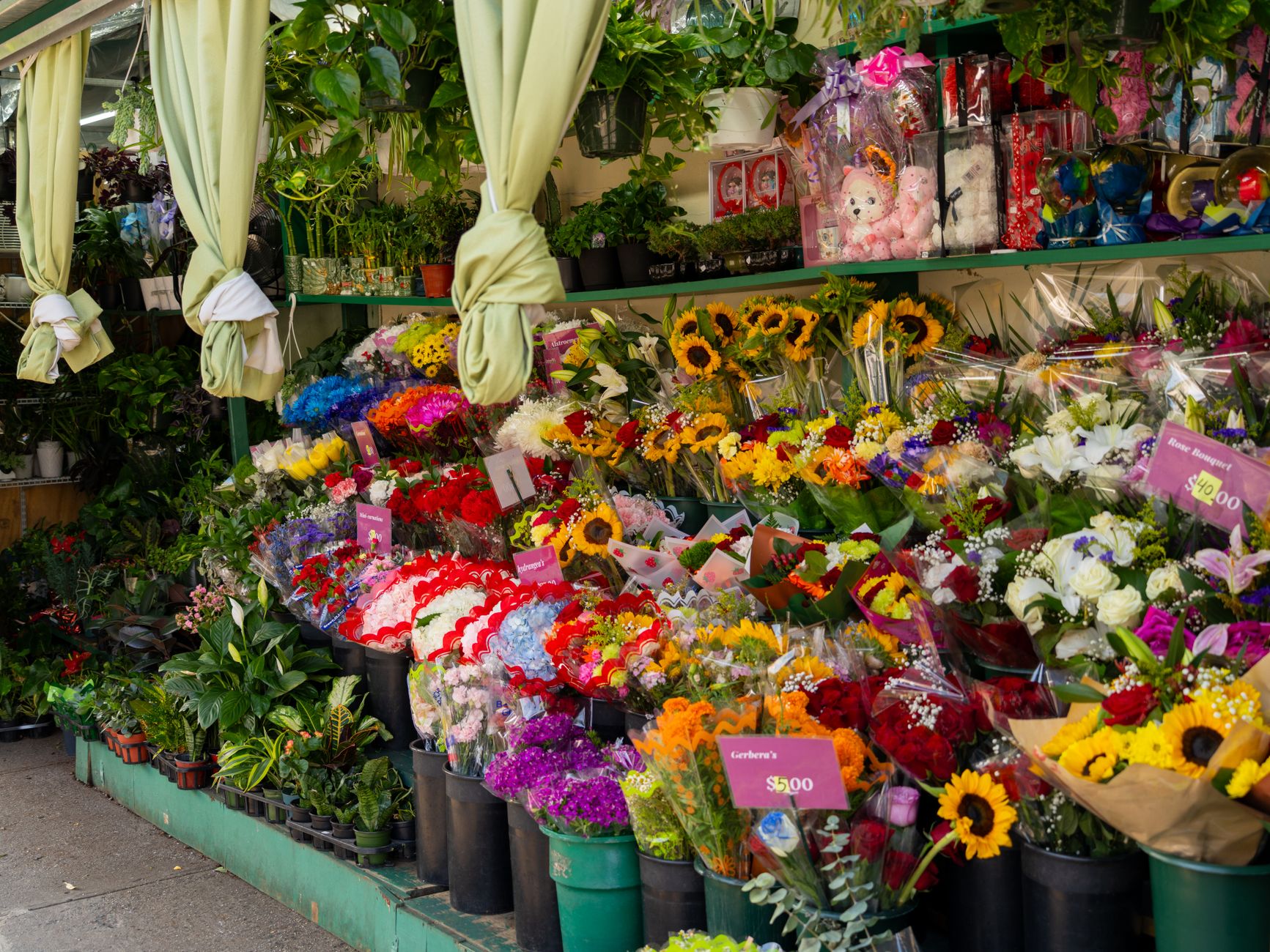 A florist preparing flowers for a local village event