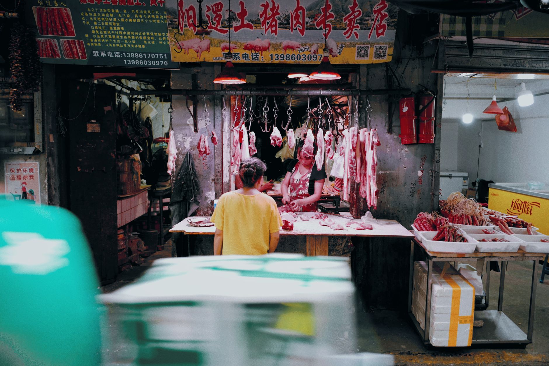 A butcher preparing a customer's order for a weekend barbecue