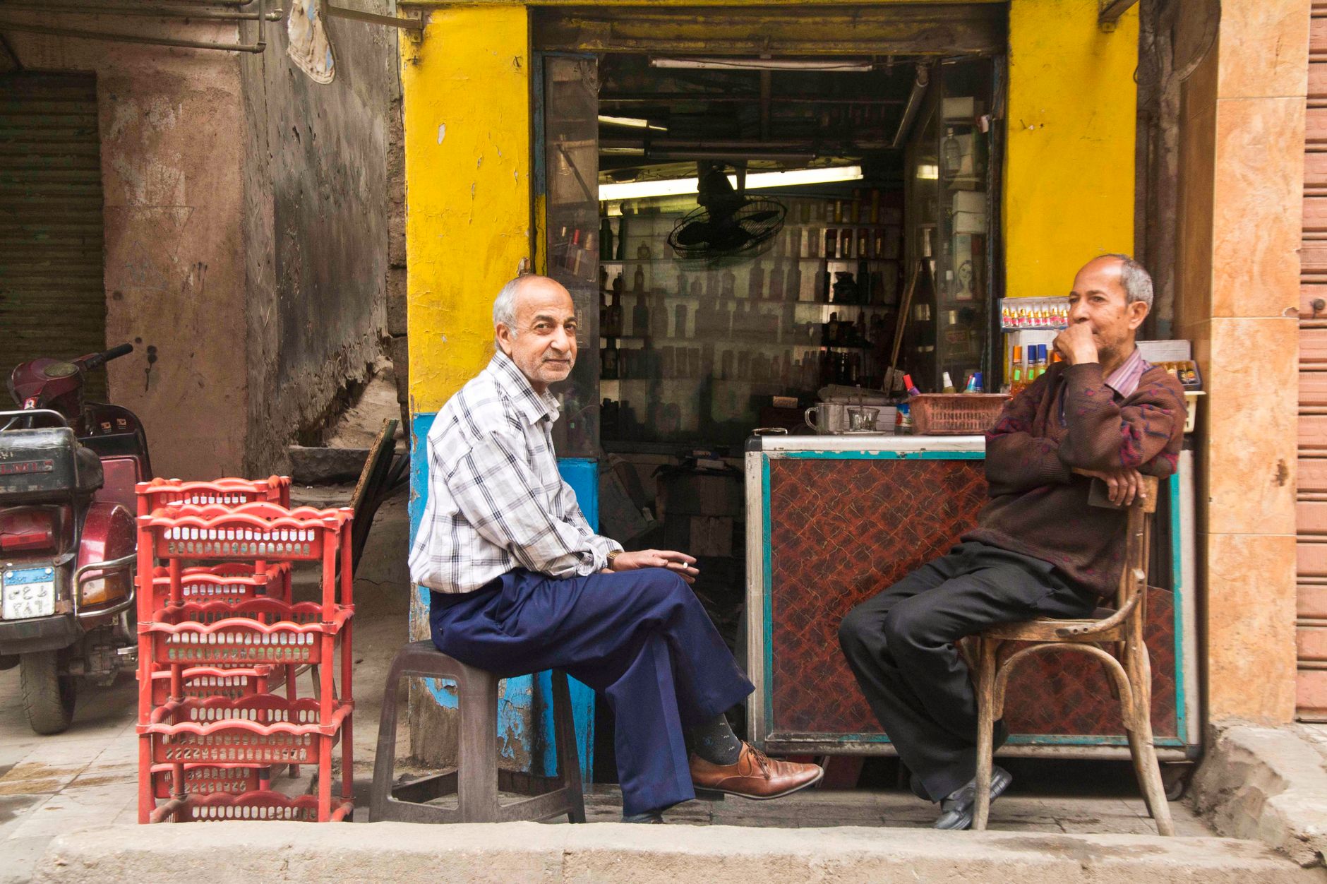 Two neighbouring shop owners planning a joint summer event