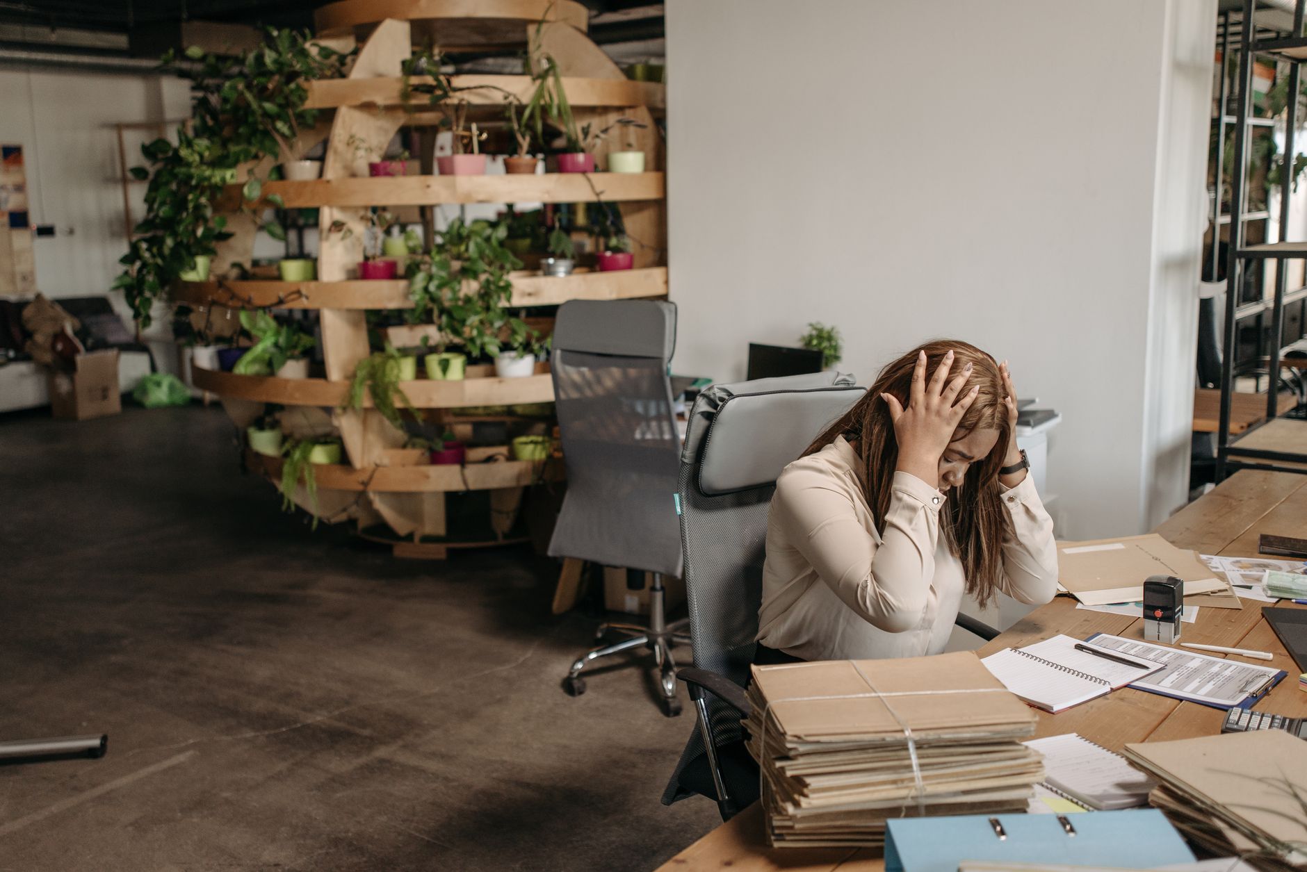 A business owner surrounded by scattered, unplanned marketing notes
