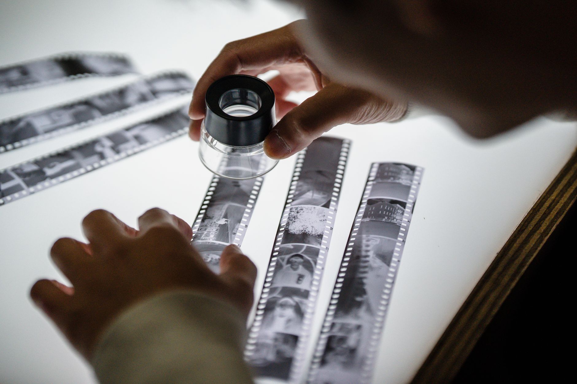A photographer choosing the one image worth showing from many