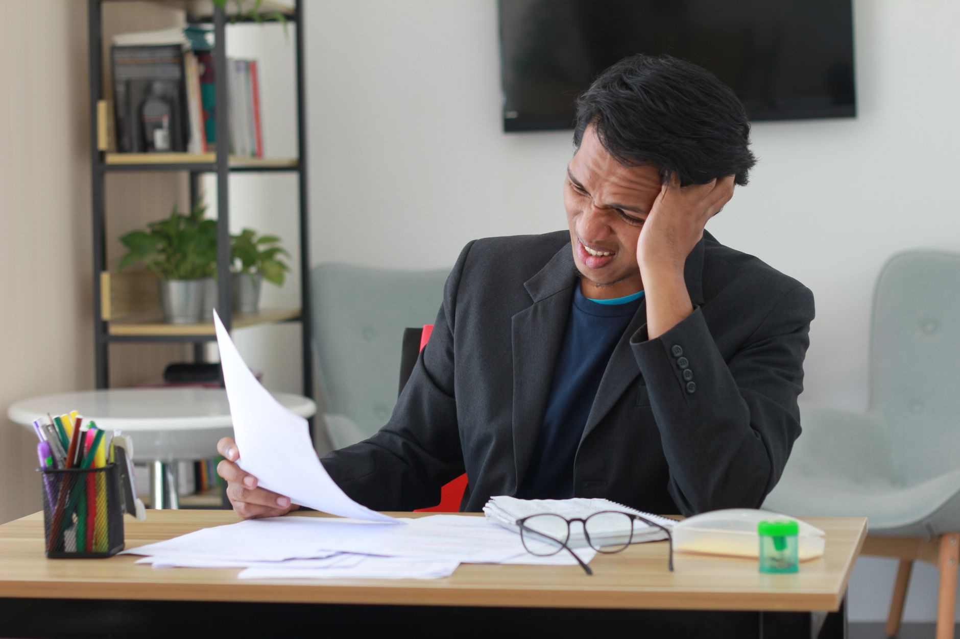 A business owner overwhelmed by conflicting marketing advice