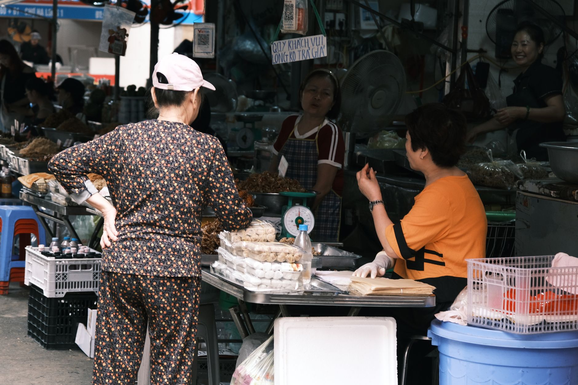 A shopper holding back from a purchase while she weighs it up