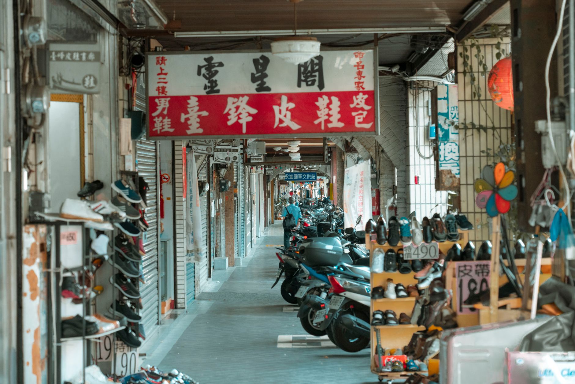 A row of similar small shop fronts competing for the same attention