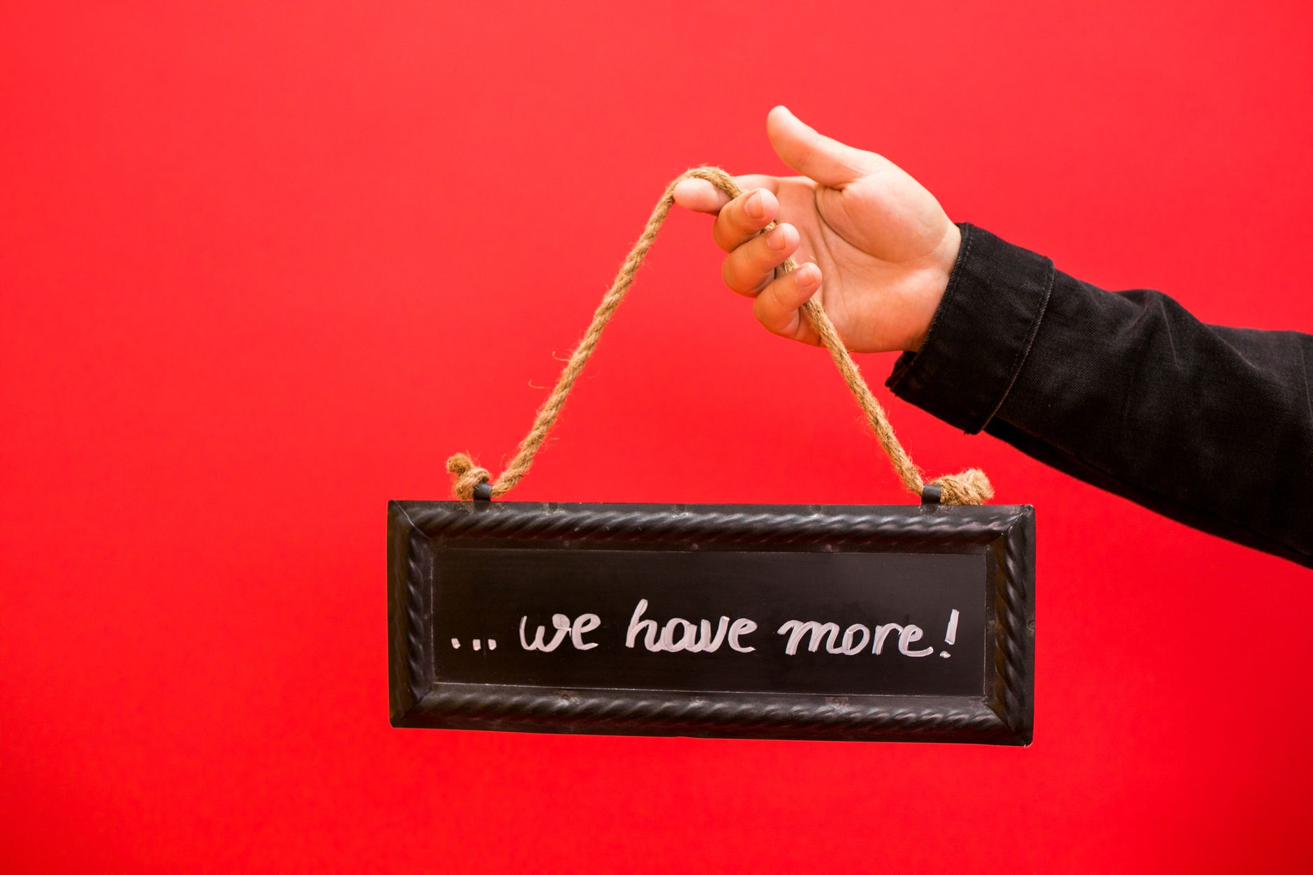 A founder choosing a personal, handwritten touch over a generic printed sign
