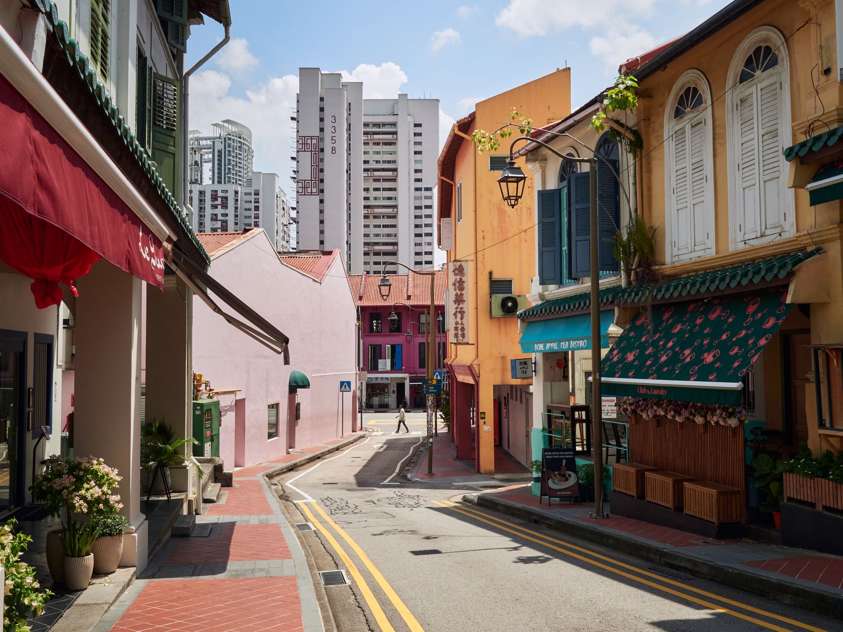 Two competing small shops on the same street, one thriving