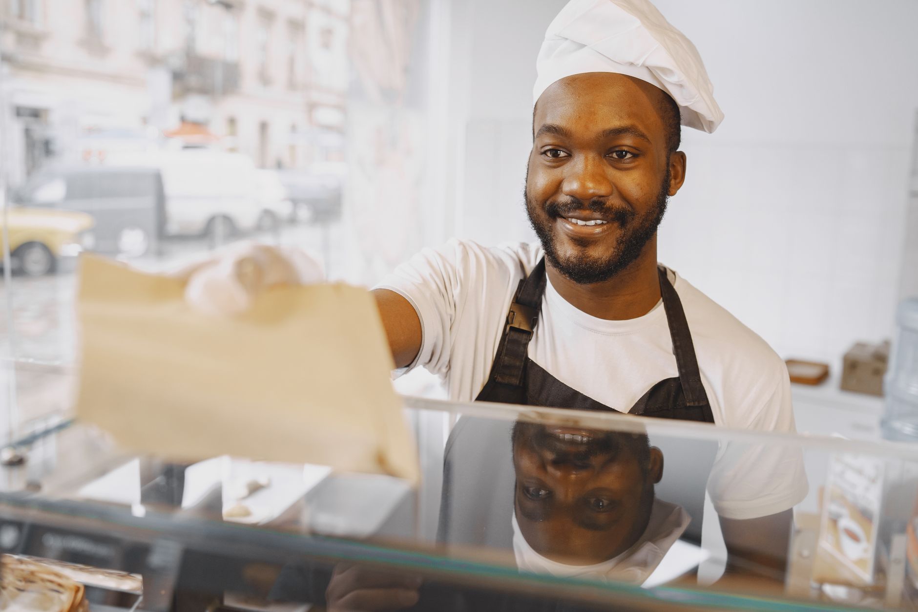 A baker serving a regular customer who trusts the business