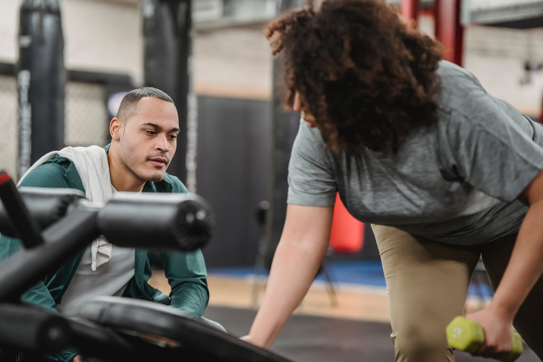 A personal trainer reviewing a client's progress together