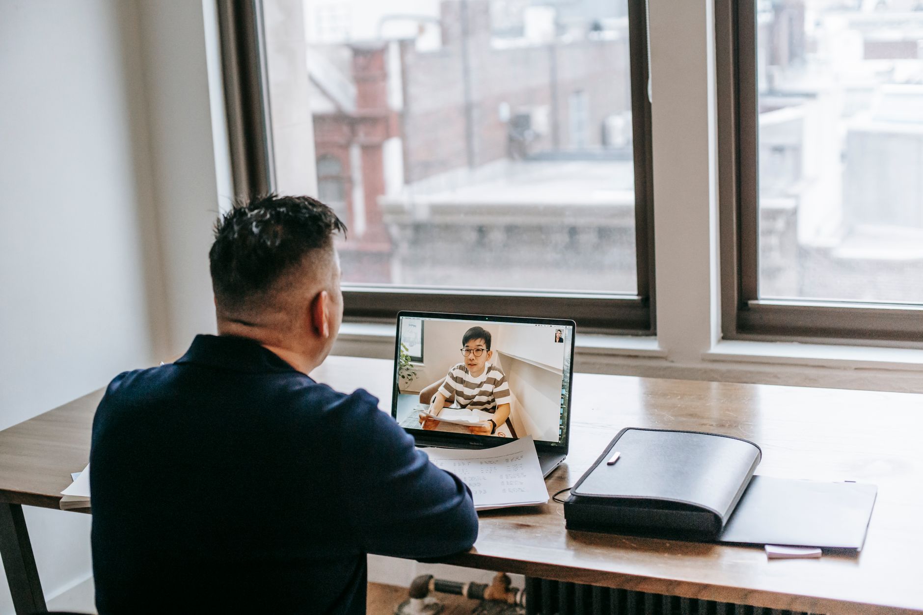 A tutor teaching a live online session to prospective students