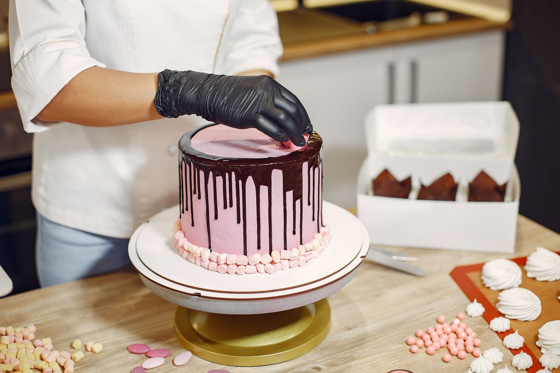 A bakery owner working alone in her small kitchen