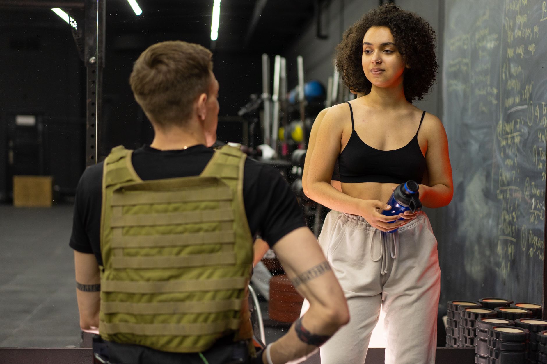 A personal trainer greeting a new client for the first time