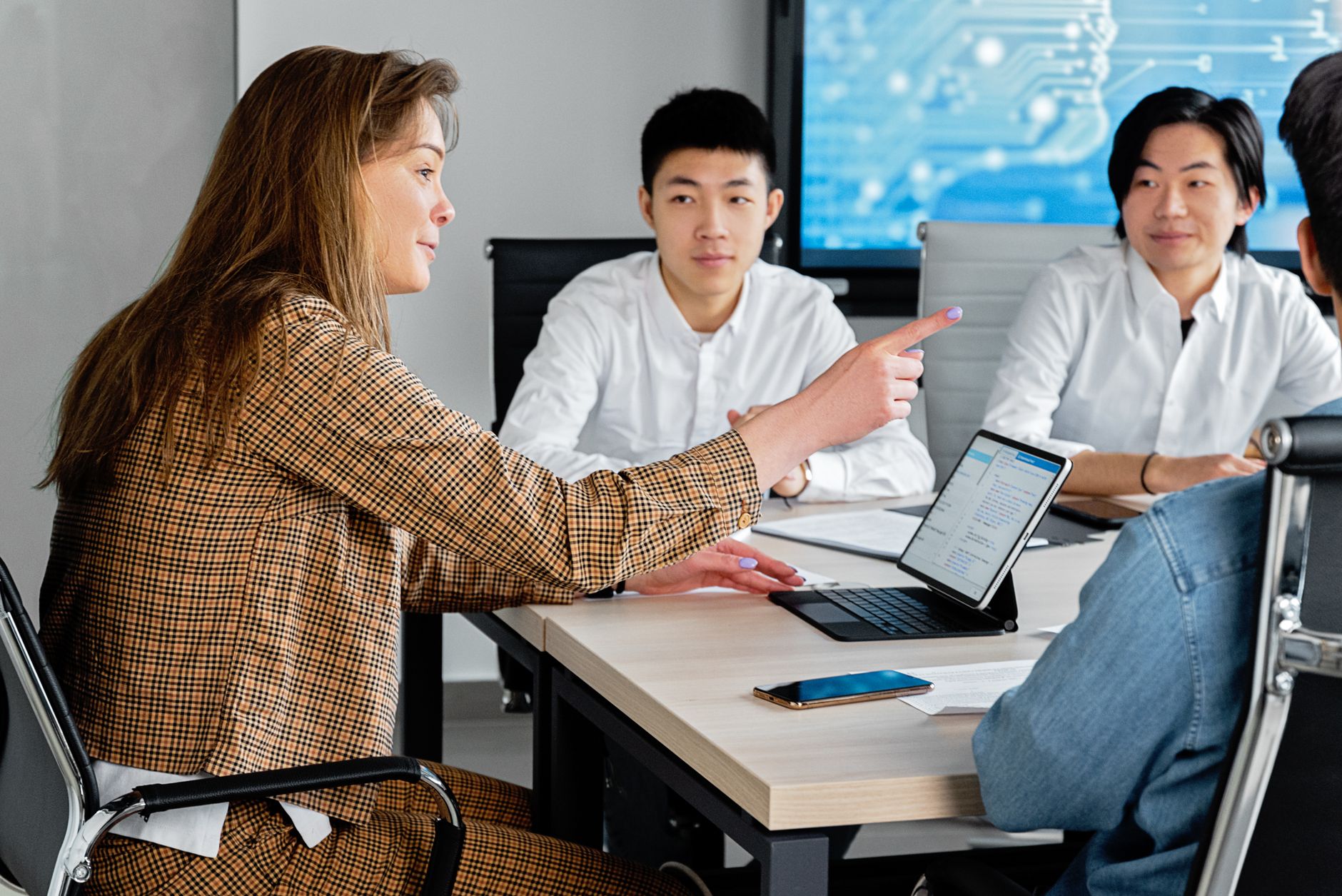 A small group of colleagues working through their marketing together