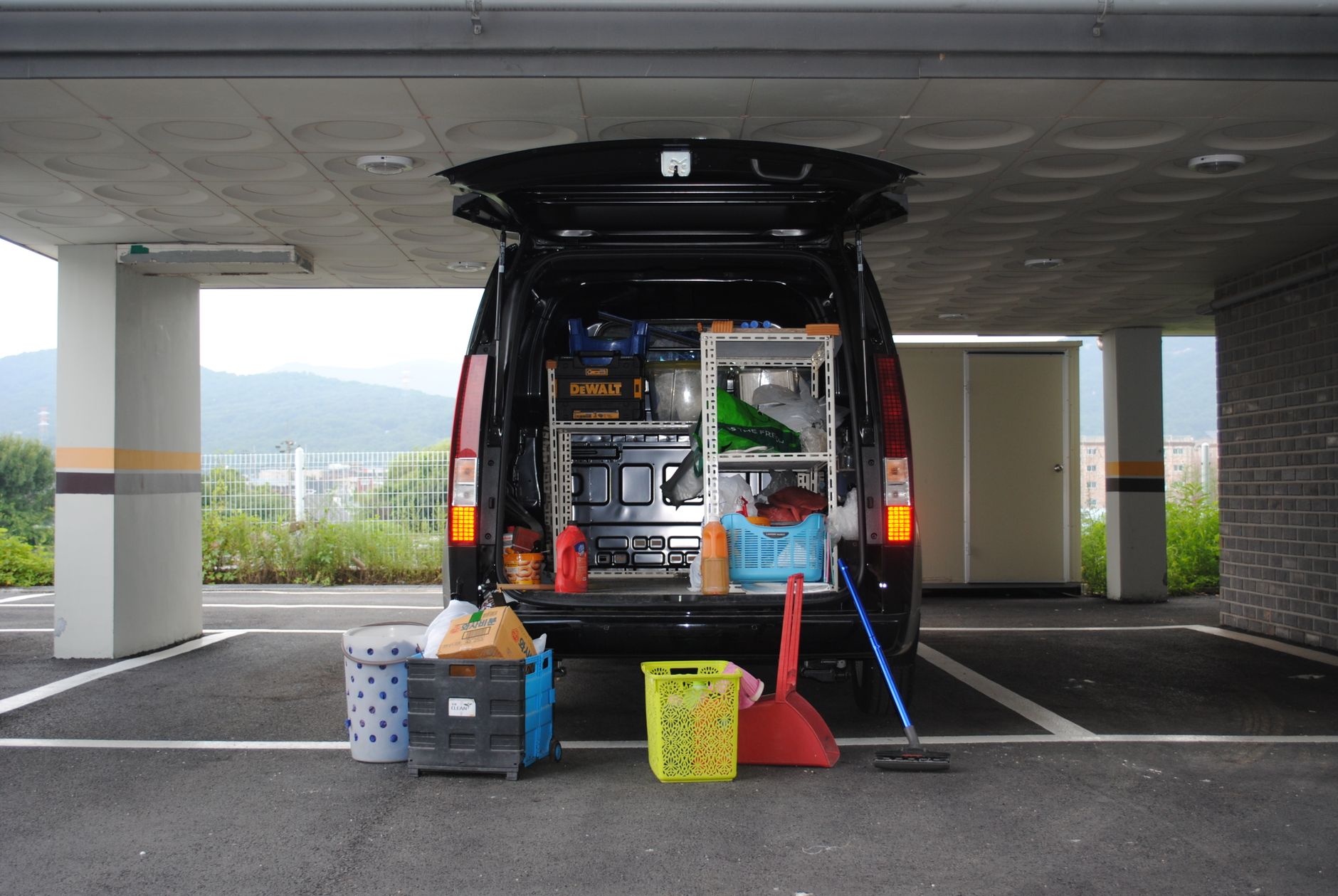 A joiner with a recognisable branded van outside a job