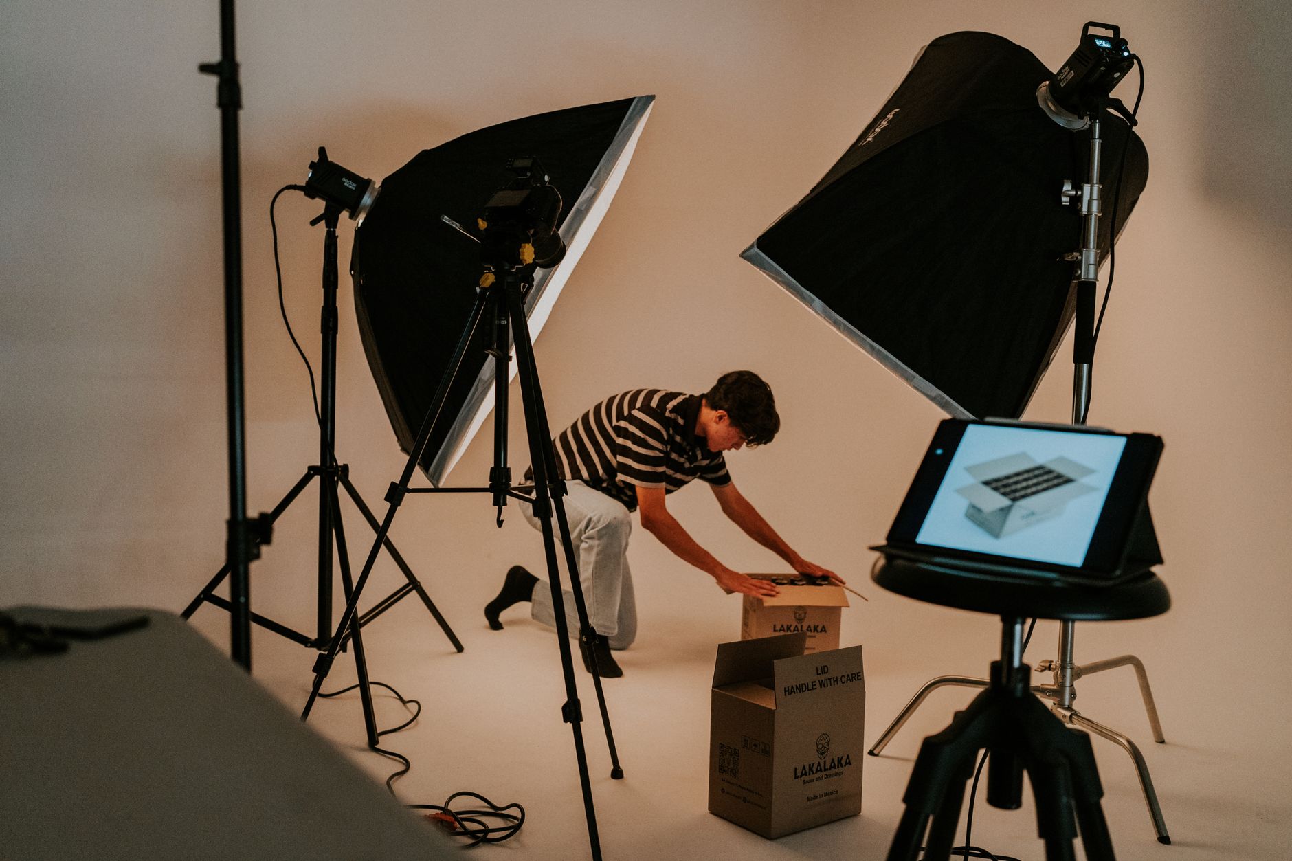 A maker preparing a consistent visual style before filming a video